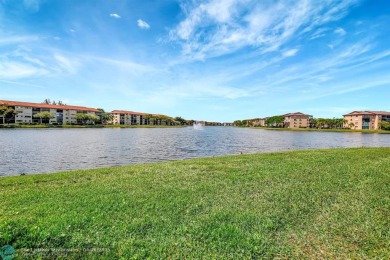 Enjoy the spectacular LAKE view from this beautiful 2/2 located on Flamingo Lakes Country Club in Florida - for sale on GolfHomes.com, golf home, golf lot