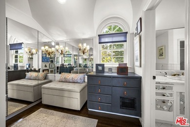 Tucked behind lush landscaping on one of the most coveted and on Los Angeles Country Club in California - for sale on GolfHomes.com, golf home, golf lot