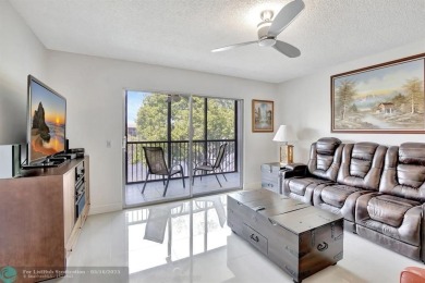 Enjoy the spectacular LAKE view from this beautiful 2/2 located on Flamingo Lakes Country Club in Florida - for sale on GolfHomes.com, golf home, golf lot