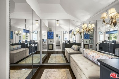 Tucked behind lush landscaping on one of the most coveted and on Los Angeles Country Club in California - for sale on GolfHomes.com, golf home, golf lot