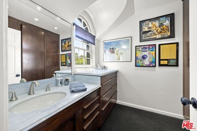 Tucked behind lush landscaping on one of the most coveted and on Los Angeles Country Club in California - for sale on GolfHomes.com, golf home, golf lot