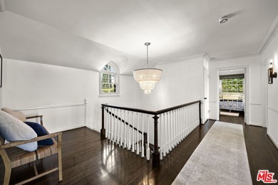 Tucked behind lush landscaping on one of the most coveted and on Los Angeles Country Club in California - for sale on GolfHomes.com, golf home, golf lot