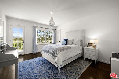 Tucked behind lush landscaping on one of the most coveted and on Los Angeles Country Club in California - for sale on GolfHomes.com, golf home, golf lot