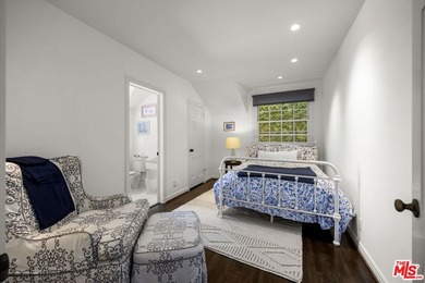 Tucked behind lush landscaping on one of the most coveted and on Los Angeles Country Club in California - for sale on GolfHomes.com, golf home, golf lot