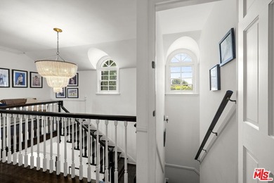 Tucked behind lush landscaping on one of the most coveted and on Los Angeles Country Club in California - for sale on GolfHomes.com, golf home, golf lot