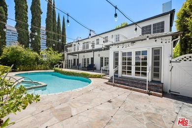 Tucked behind lush landscaping on one of the most coveted and on Los Angeles Country Club in California - for sale on GolfHomes.com, golf home, golf lot