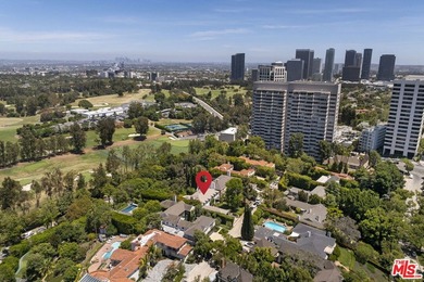 Tucked behind lush landscaping on one of the most coveted and on Los Angeles Country Club in California - for sale on GolfHomes.com, golf home, golf lot