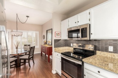 Tucked inside the beautifully landscaped Village Square Condos on Westbrook Village Golf Club in Arizona - for sale on GolfHomes.com, golf home, golf lot