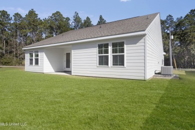 Looks like new! But this precious cottage in a quiet area of on Diamondhead Country Club in Mississippi - for sale on GolfHomes.com, golf home, golf lot