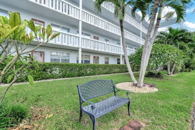 Experience serene waterfront living in this beautifully on Hillsboro Pines Golf in Florida - for sale on GolfHomes.com, golf home, golf lot