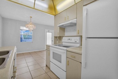 Experience serene waterfront living in this beautifully on Hillsboro Pines Golf in Florida - for sale on GolfHomes.com, golf home, golf lot