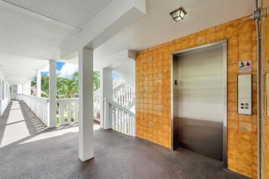 Experience serene waterfront living in this beautifully on Hillsboro Pines Golf in Florida - for sale on GolfHomes.com, golf home, golf lot