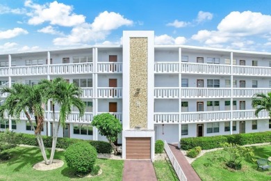 Experience serene waterfront living in this beautifully on Hillsboro Pines Golf in Florida - for sale on GolfHomes.com, golf home, golf lot