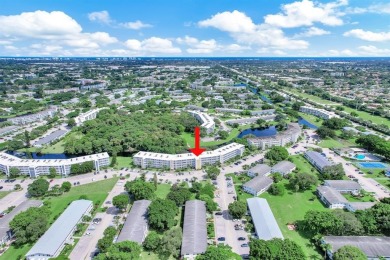Experience serene waterfront living in this beautifully on Hillsboro Pines Golf in Florida - for sale on GolfHomes.com, golf home, golf lot