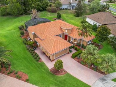 IMPROVED PRICE--An iconic palm tree and elegant paver driveway on Harbor Hills Country Club in Florida - for sale on GolfHomes.com, golf home, golf lot