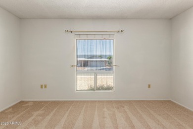 Welcome home to this light and bright 2-bedroom, 2-bath home on Sun City Lakes West and East in Arizona - for sale on GolfHomes.com, golf home, golf lot