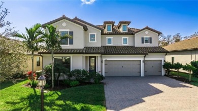 Discover luxury living within the serene coastal modern ambiance on Old Corkscrew Golf Club in Florida - for sale on GolfHomes.com, golf home, golf lot