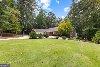 Enjoy the sunset views from 103 Lakeshore Drive, a remarkable on Highland Country Club in Georgia - for sale on GolfHomes.com, golf home, golf lot