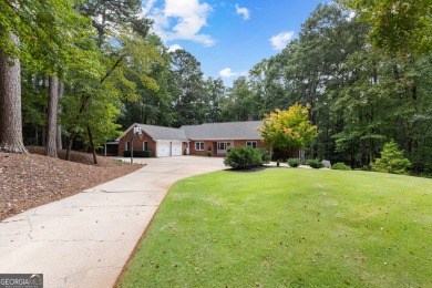 Enjoy the sunset views from 103 Lakeshore Drive, a remarkable on Highland Country Club in Georgia - for sale on GolfHomes.com, golf home, golf lot
