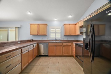 IMMACULATE, TURNKEY 3/2 BLOCK and STUCCO courtyard villa with on The Links of Spruce Creek in Florida - for sale on GolfHomes.com, golf home, golf lot