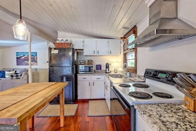 Charming Lake Burton Cottage with Deeded Lake Access - Under on Waterfall Country Club in Georgia - for sale on GolfHomes.com, golf home, golf lot