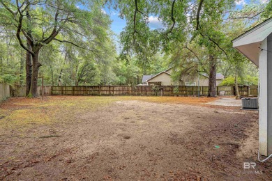 This charming 3 bed/2 bath Lake Forest cottage on a spacious on Lake Forest Yacht and Country Club in Alabama - for sale on GolfHomes.com, golf home, golf lot