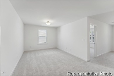 This semi-custom home in Lake Royale offers 3BR/2.5BA and a on River Golf and County Club at Lake Royale in North Carolina - for sale on GolfHomes.com, golf home, golf lot