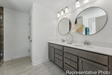 This semi-custom home in Lake Royale offers 3BR/2.5BA and a on River Golf and County Club at Lake Royale in North Carolina - for sale on GolfHomes.com, golf home, golf lot