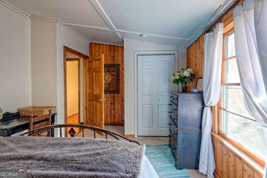 Charming Lake Burton Cottage with Deeded Lake Access - Under on Waterfall Country Club in Georgia - for sale on GolfHomes.com, golf home, golf lot