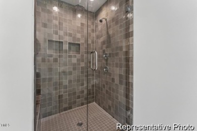 This semi-custom home in Lake Royale offers 3BR/2.5BA and a on River Golf and County Club at Lake Royale in North Carolina - for sale on GolfHomes.com, golf home, golf lot