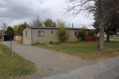 Great location for this clean and tidy older mobile in Three on Headwaters Golf Course in Montana - for sale on GolfHomes.com, golf home, golf lot