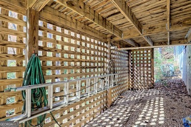 Charming Lake Burton Cottage with Deeded Lake Access - Under on Waterfall Country Club in Georgia - for sale on GolfHomes.com, golf home, golf lot