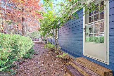 Charming Lake Burton Cottage with Deeded Lake Access - Under on Waterfall Country Club in Georgia - for sale on GolfHomes.com, golf home, golf lot