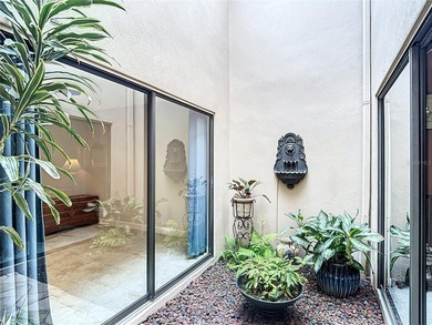 Palm Harbor - Nestled in the gated community of Wescott Square on Tarpon Woods Golf Club in Florida - for sale on GolfHomes.com, golf home, golf lot