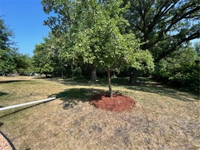 Over half acre wooded lot adjoining the golf course in Redwood on Redwood Falls Golf Club in Minnesota - for sale on GolfHomes.com, golf home, golf lot