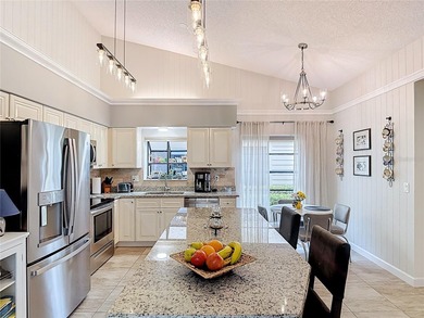 Palm Harbor - Nestled in the gated community of Wescott Square on Tarpon Woods Golf Club in Florida - for sale on GolfHomes.com, golf home, golf lot