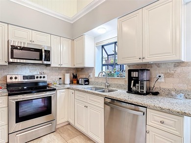 Palm Harbor - Nestled in the gated community of Wescott Square on Tarpon Woods Golf Club in Florida - for sale on GolfHomes.com, golf home, golf lot