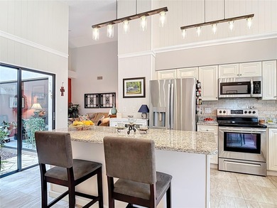 Palm Harbor - Nestled in the gated community of Wescott Square on Tarpon Woods Golf Club in Florida - for sale on GolfHomes.com, golf home, golf lot