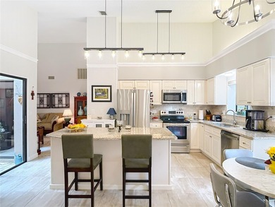 Palm Harbor - Nestled in the gated community of Wescott Square on Tarpon Woods Golf Club in Florida - for sale on GolfHomes.com, golf home, golf lot