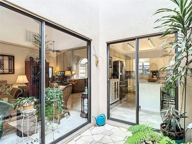 Palm Harbor - Nestled in the gated community of Wescott Square on Tarpon Woods Golf Club in Florida - for sale on GolfHomes.com, golf home, golf lot