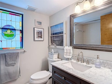 Palm Harbor - Nestled in the gated community of Wescott Square on Tarpon Woods Golf Club in Florida - for sale on GolfHomes.com, golf home, golf lot