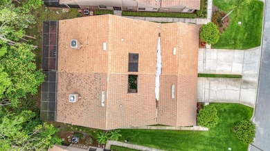 Palm Harbor - Nestled in the gated community of Wescott Square on Tarpon Woods Golf Club in Florida - for sale on GolfHomes.com, golf home, golf lot