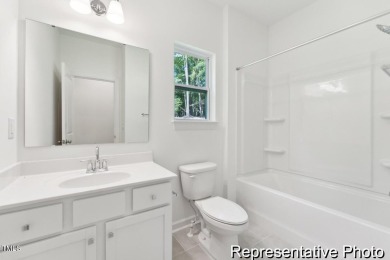 This semi-custom home in the gated, resort-style Lake Royale on River Golf and County Club at Lake Royale in North Carolina - for sale on GolfHomes.com, golf home, golf lot