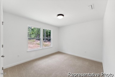 This semi-custom home in the gated, resort-style Lake Royale on River Golf and County Club at Lake Royale in North Carolina - for sale on GolfHomes.com, golf home, golf lot