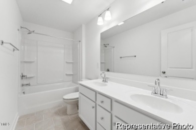 This semi-custom home in the gated, resort-style Lake Royale on River Golf and County Club at Lake Royale in North Carolina - for sale on GolfHomes.com, golf home, golf lot