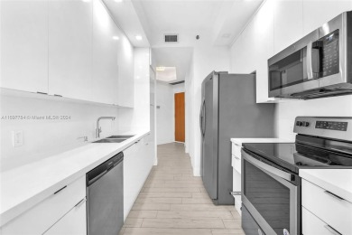 Stunning remodeled unit with golf views! Experience modern on Turnberry Isle Resort and Club in Florida - for sale on GolfHomes.com, golf home, golf lot