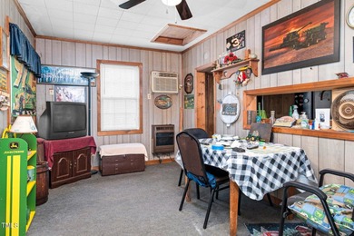 Escape to Lake Royale with this unique weekend retreat at 106 & on River Golf and Country Club at Lake Royale in North Carolina - for sale on GolfHomes.com, golf home, golf lot