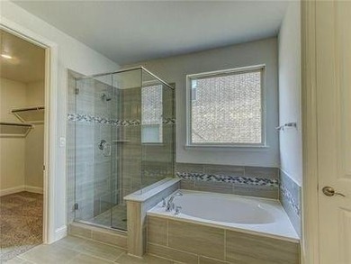 This property is in the sought-after The Tribute community in on The Tribute At the Colony in Texas - for sale on GolfHomes.com, golf home, golf lot