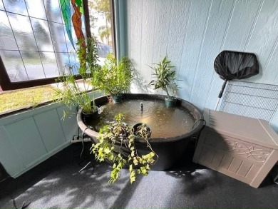 Welcome your guests to a private and serene space, situated on on Del Tura Golf and Country Club in Florida - for sale on GolfHomes.com, golf home, golf lot