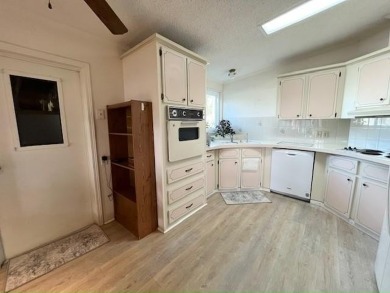Welcome your guests to a private and serene space, situated on on Del Tura Golf and Country Club in Florida - for sale on GolfHomes.com, golf home, golf lot